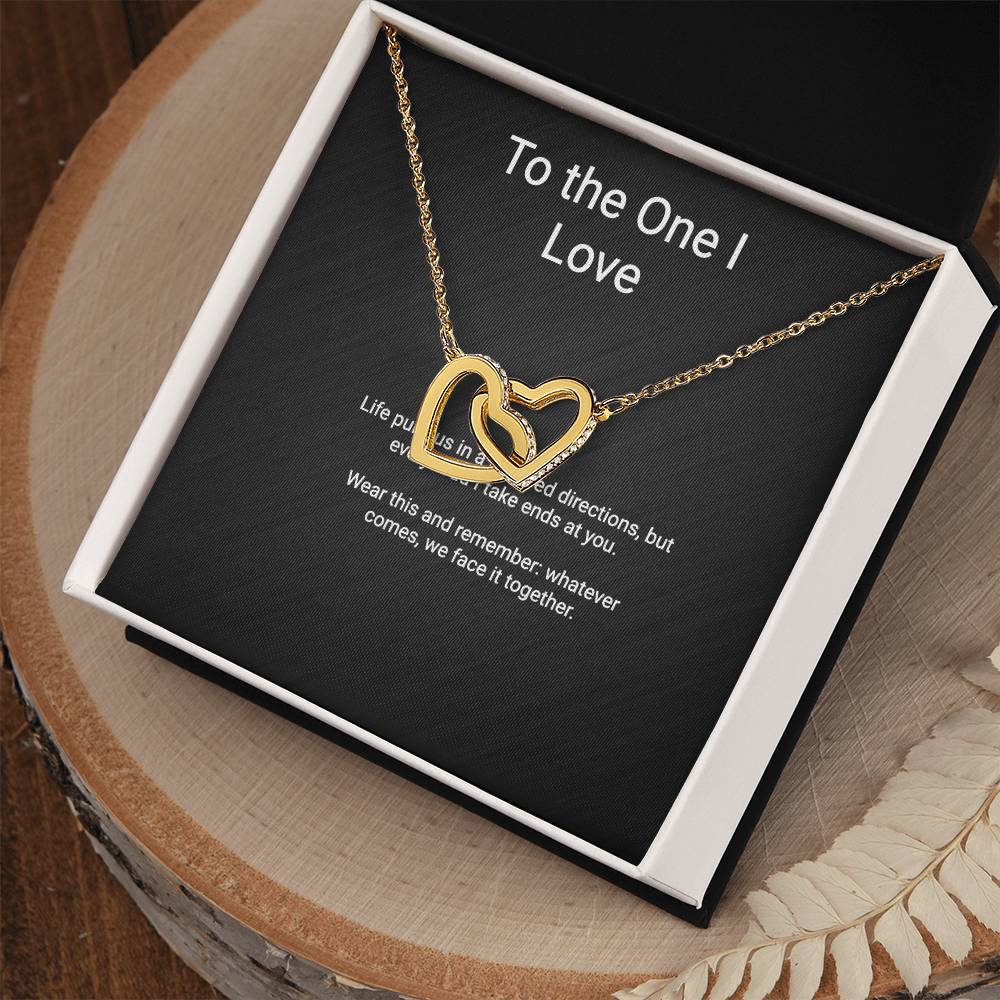 Interlocking Hearts couples pendant necklace — close-up
