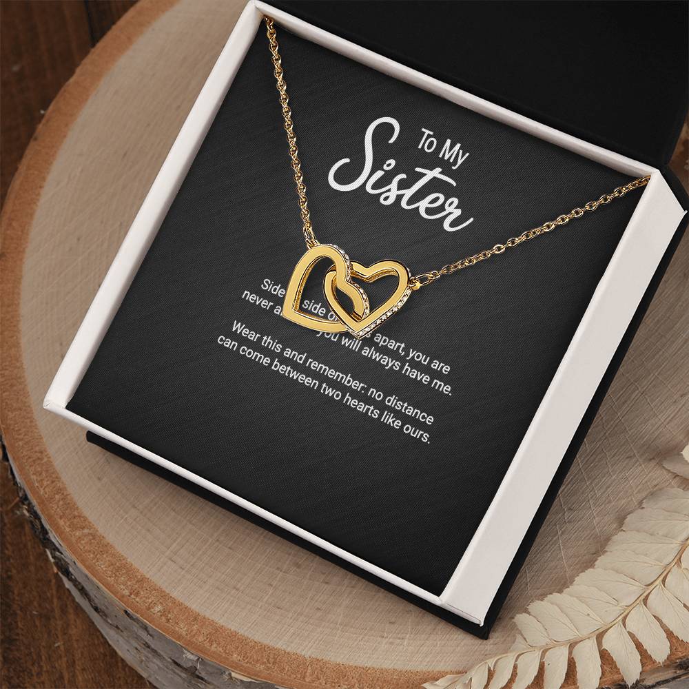 Interlocking Hearts pendant necklace for sister — close-up
