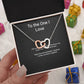Every Road Ends at You interlocking hearts couples necklace with message card, held in hand among gifts
